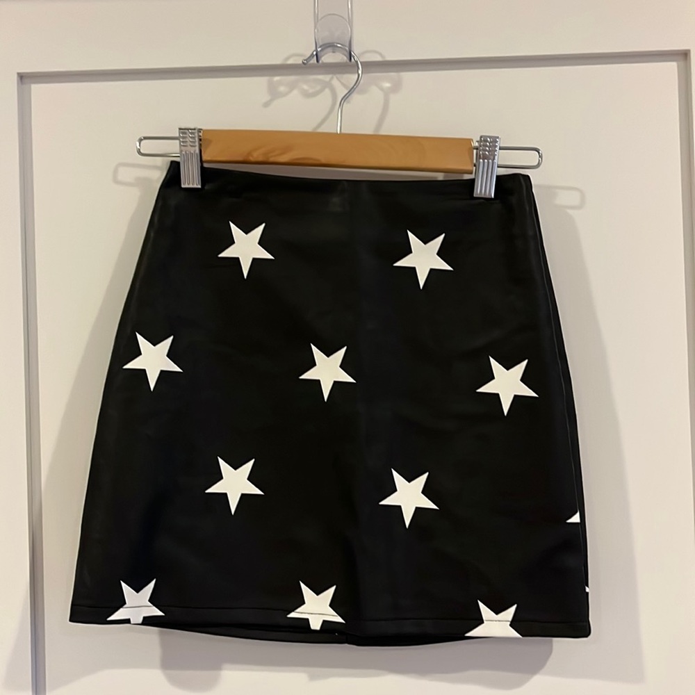 Black leather mini skirt with stars, size XS altered state